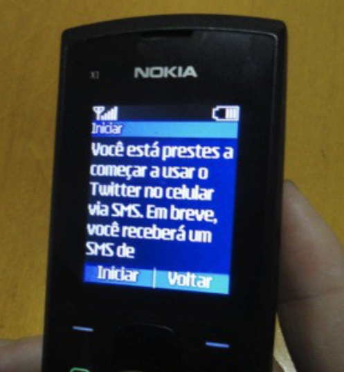 Picture of a Nokia S30 phone running GEMS, an sms-based app store